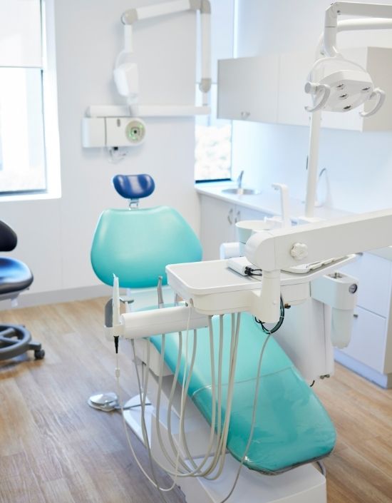 Happy woman at the dentist - cosmetic dentistry MA